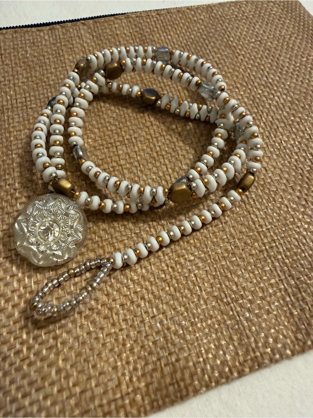 White and Gold Beaded Wrap Necklace with Decorative Pendant